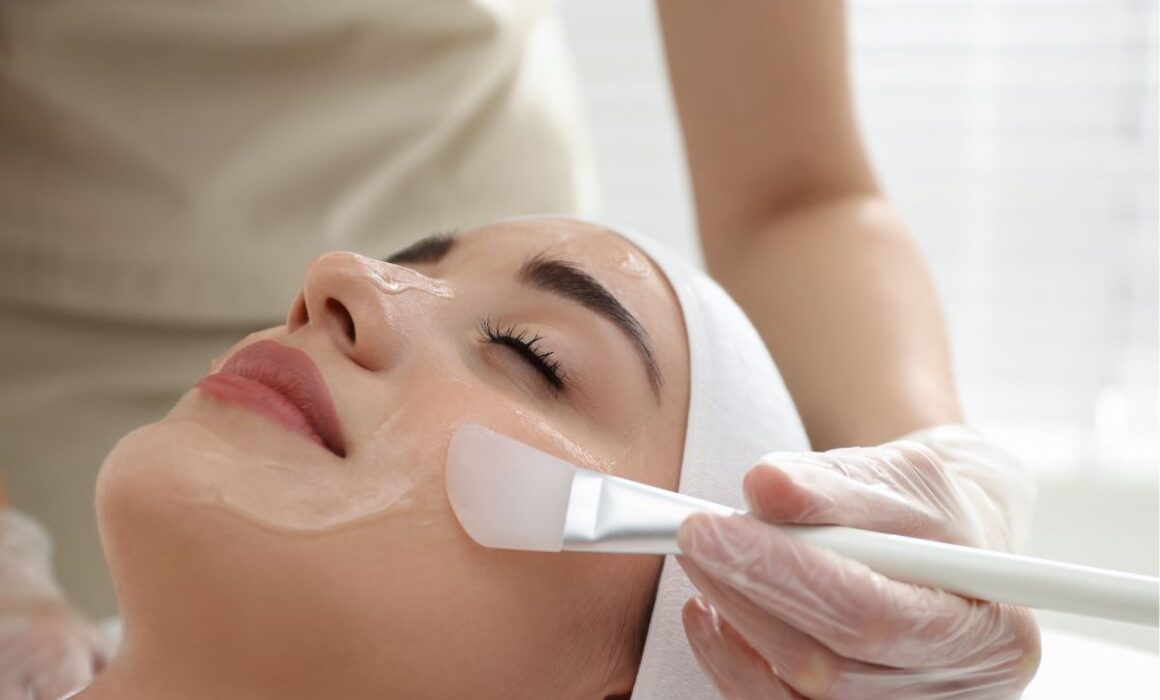 Woman receiving a chemical peel for sun-damaged skin at Scottsdale Med Spa.