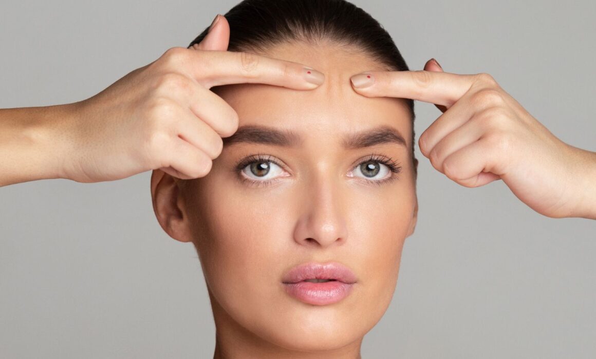 Aesthetic specialist consulting with patient about botox and dermal filler treatments in Scottsdale